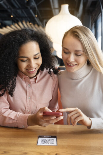 Medium Shot Women Holding Smartphones